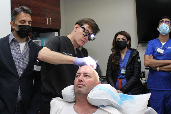 Dr Chaffoo demonstrating surgery